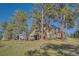 Spacious backyard with large deck, ideal for entertaining or relaxing outdoors at 25875 Buffalo Ln, Golden, CO 80401