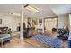 Open basement with hardwood floors, a lounge area, and an exercise area at 25875 Buffalo Ln, Golden, CO 80401