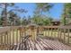 Cozy deck with table and chairs offers a peaceful outdoor space surrounded by lush greenery at 25875 Buffalo Ln, Golden, CO 80401