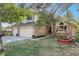 Lovely exterior view of a home with mature trees, an American flag, and an inviting hammock at 25875 Buffalo Ln, Golden, CO 80401