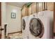 Spacious laundry room with washer, dryer, and ample storage at 25875 Buffalo Ln, Golden, CO 80401