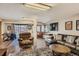 Spacious living room with hardwood floors, dart board, and a walkout to a hot tub at 25875 Buffalo Ln, Golden, CO 80401