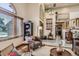 Bright living room featuring vaulted ceiling, ample natural light, and an open layout at 25875 Buffalo Ln, Golden, CO 80401