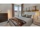 Bedroom featuring a ceiling fan, natural light, and minimalist wall decor at 8982 Delacorte St, Littleton, CO 80129