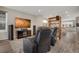 Entertainment room featuring comfortable seating, large screen, and an open floor plan at 8982 Delacorte St, Littleton, CO 80129