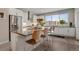 Modern kitchen featuring a large island, stainless steel appliances, and a bright, open layout at 8982 Delacorte St, Littleton, CO 80129