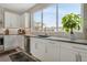 Well-lit kitchen showcasing sleek countertops, stainless steel appliances, and a modern design at 8982 Delacorte St, Littleton, CO 80129