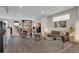 Spacious living room with hardwood floors, open shelving, and contemporary furnishings at 8982 Delacorte St, Littleton, CO 80129