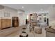 Bright and open living room with hardwood floors, modern furnishings, and stylish accents at 8982 Delacorte St, Littleton, CO 80129