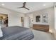 Spacious bedroom with a walk-in closet, en-suite bathroom, and modern furnishings at 8982 Delacorte St, Littleton, CO 80129