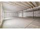 Unfinished basement featuring exposed beams and support posts with plastic-covered walls at 1613 Bloom St, Brighton, CO 80601