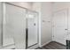 Bright bathroom with a clear glass walk-in shower that features a built-in bench and modern fixtures at 1613 Bloom St, Brighton, CO 80601