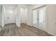 Bright entryway with wood floors and glass paneled doors at 1613 Bloom St, Brighton, CO 80601