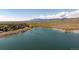 Scenic aerial view of lakefront community offering serene water views and lush natural beauty at 6668 Fairways Dr, Longmont, CO 80503