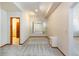 Basement showcasing carpeted floors, a mirror, and doorway access at 6668 Fairways Dr, Longmont, CO 80503