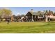 Golf course clubhouse featuring outdoor patio seating overlooking the green with beautiful natural light at 6668 Fairways Dr, Longmont, CO 80503