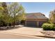 Beautiful brick and siding home with a spacious three-car garage and a well-maintained driveway at 6668 Fairways Dr, Longmont, CO 80503