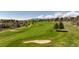 Well-manicured golf course featuring lush green fairways and strategically placed sand traps at 6668 Fairways Dr, Longmont, CO 80503