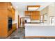 Well-lit kitchen boasts modern appliances, a large island, and ample cabinet space for storage at 6668 Fairways Dr, Longmont, CO 80503
