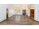 Bright and spacious living room featuring vaulted ceilings, hardwood floors, and large windows at 6668 Fairways Dr, Longmont, CO 80503