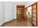 Office space with hardwood floors, French doors and built-in bookcase at 6668 Fairways Dr, Longmont, CO 80503