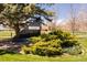Community signage surrounded by lush landscaping and trees, enhancing the neighborhood's charm at 6668 Fairways Dr, Longmont, CO 80503