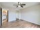 Bright bedroom features laminate flooring and mirrored closet doors, adding space and style at 10150 E Virginia Ave # 301, Denver, CO 80247