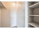 Inside walk-in closet with shelving on the right side at 10150 E Virginia Ave # 301, Denver, CO 80247