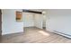 Bright dining area with laminate flooring, chandelier and kitchen cabinets in the background at 10150 E Virginia Ave # 301, Denver, CO 80247