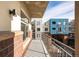 View from a balcony showing the colorful architecture and design of nearby apartment buildings at 3701 Arapahoe Ave # 318, Boulder, CO 80303