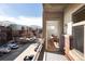 Balcony with mountain view showing nearby colorful apartment buildings and parking at 3701 Arapahoe Ave # 318, Boulder, CO 80303