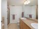 Spacious bathroom with double sinks, granite countertop, walk-in shower and modern fixtures at 3701 Arapahoe Ave # 318, Boulder, CO 80303