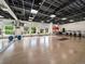 Bright fitness studio with hardwood floors, mirrors, windows, and exercise equipment at 3701 Arapahoe Ave # 318, Boulder, CO 80303