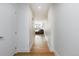 Clean hallway with wood floors leading to a living area at 3701 Arapahoe Ave # 318, Boulder, CO 80303