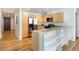 A bright kitchen boasts stainless steel appliances, a breakfast bar, and hardwood floors at 3701 Arapahoe Ave # 318, Boulder, CO 80303