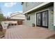 Charming backyard deck with access to the house, complemented by a well-maintained garden and a cozy seating area at 6167 S Pierson St, Littleton, CO 80127
