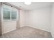 Simple bedroom with a window and gray carpet at 6167 S Pierson St, Littleton, CO 80127