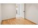 Cozy bedroom with wood floors and an open doorway at 6167 S Pierson St, Littleton, CO 80127