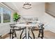 Bright dining room with a modern chandelier, natural light and open concept view of the home at 6167 S Pierson St, Littleton, CO 80127