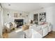 Modern living room features a cozy fireplace, neutral colors, ample seating, and stylish decor at 6167 S Pierson St, Littleton, CO 80127