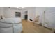 Finished basement with an open layout, featuring neutral decor, wood floors, and plenty of natural light at 18714 E Utah Cir, Aurora, CO 80017