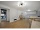 Spacious finished basement with light wood flooring, large furniture, and ample lighting at 18714 E Utah Cir, Aurora, CO 80017
