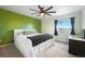 Bright bedroom with large windows, ceiling fan, and space for a desk at 18714 E Utah Cir, Aurora, CO 80017