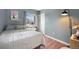 Bedroom showcasing natural light from window, complete with bedside table, lamp, and neutral tones at 18714 E Utah Cir, Aurora, CO 80017