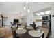 Open dining space with easy access to the modern kitchen and comfortable living area at 18714 E Utah Cir, Aurora, CO 80017