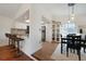 Cozy dining area with modern fixtures, a bar-height seating area, and natural light at 18714 E Utah Cir, Aurora, CO 80017