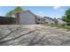 A well-maintained driveway leading to a spacious two-car garage with ample parking space at 18714 E Utah Cir, Aurora, CO 80017