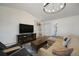 Bright living room featuring a fireplace, open staircase, and plenty of space for entertaining at 18714 E Utah Cir, Aurora, CO 80017
