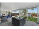 Covered patio showcasing a dining set, barbecue grill, and backyard with shed at 18714 E Utah Cir, Aurora, CO 80017