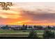 Scenic sunset view from this community, showcasing an orange sky over the mountains at 18714 E Utah Cir, Aurora, CO 80017